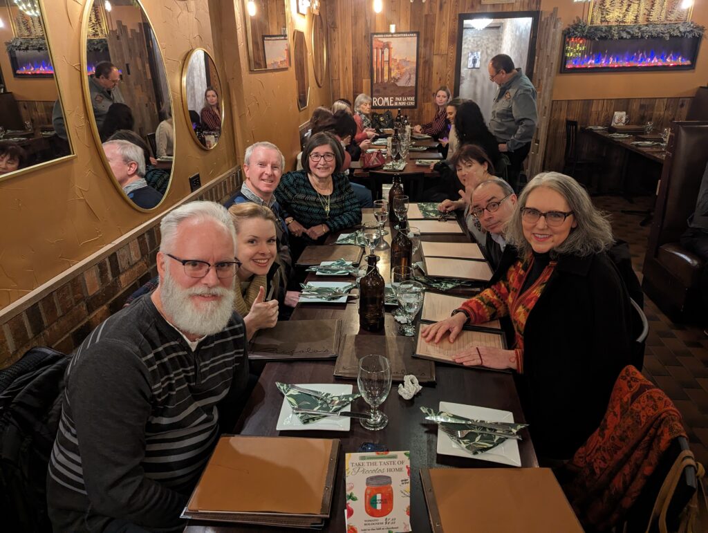 A photo of members from The Wandering Francophones, a group of individuals who gather a few times a month to speak French at nearby restaurants.