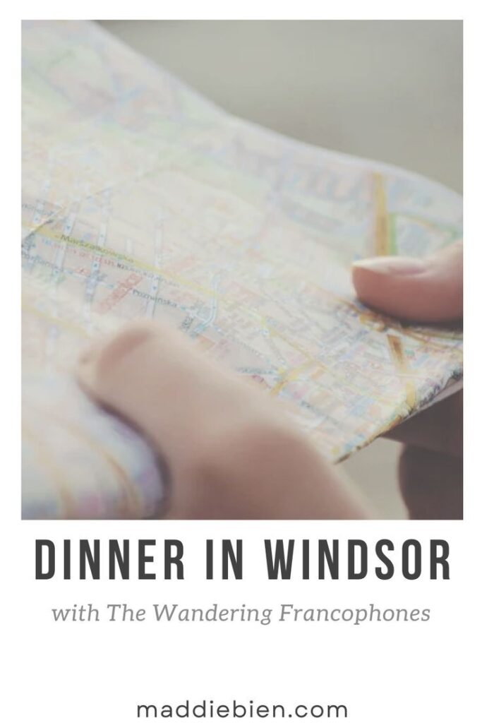 An image of a person's thumbs holding onto a map with the text below stating "Dinner in Windsor with the Wandering Francophones". A link to Maddie's website is below.