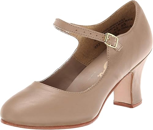 An image of a women's beige character shoe with a 2" heel and a strap against a whilte background.