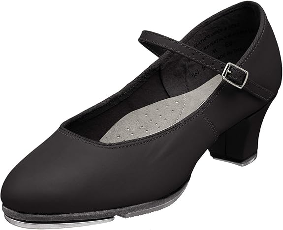 An image of a women's black character shoe with a 1.5" heel and black strap against a white background.